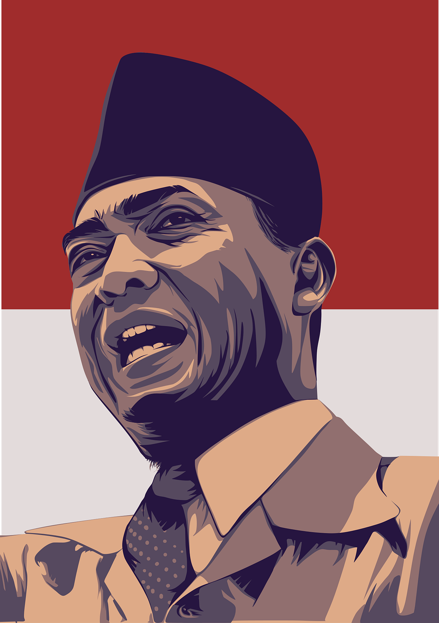 Presiden Soekarno dengan peci hitam dan pakaian formal di depan bendera merah putih: simbol semangat kemerdekaan Indonesia.